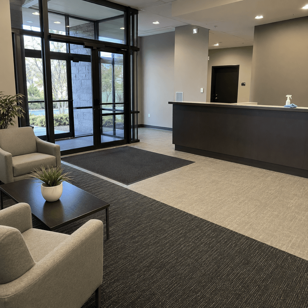 Clean office reception lobby with entry mats after recurring office cleaning