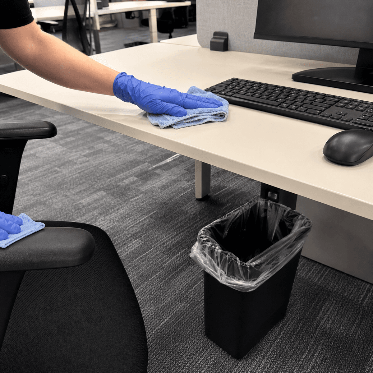 Office workstation detail cleaning with keyboard and desk touchpoints